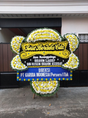 Papan Bunga Duka di Ujung Batu