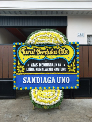 Papan Bunga Duka di Ujung Batu